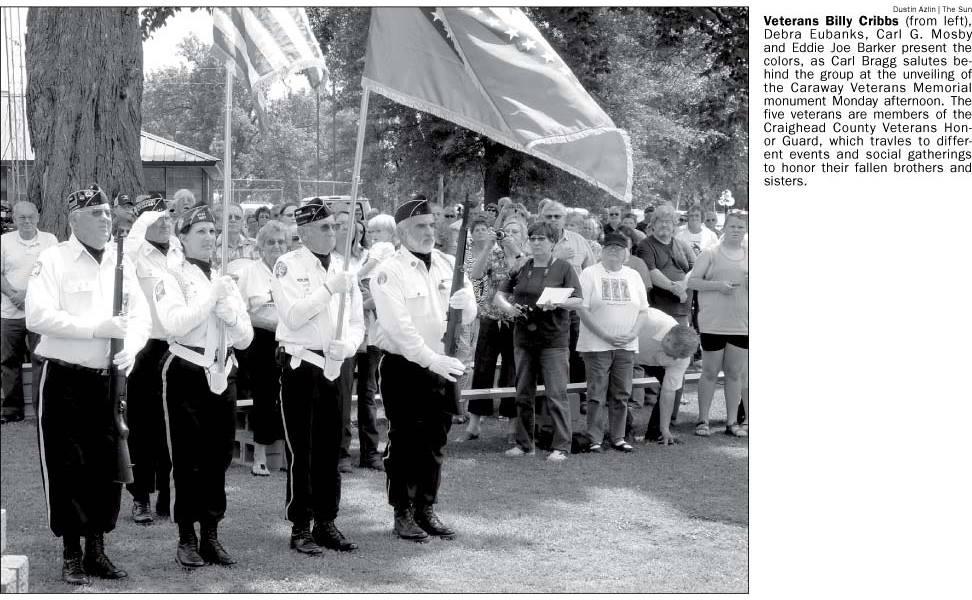 Newspaper article snippet: Veterans present the colors at Caraway Veterans Monument unveiling